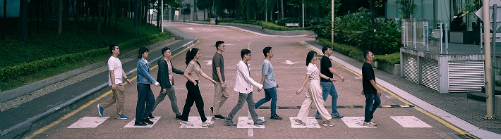 HoopTech Games team crossing the road